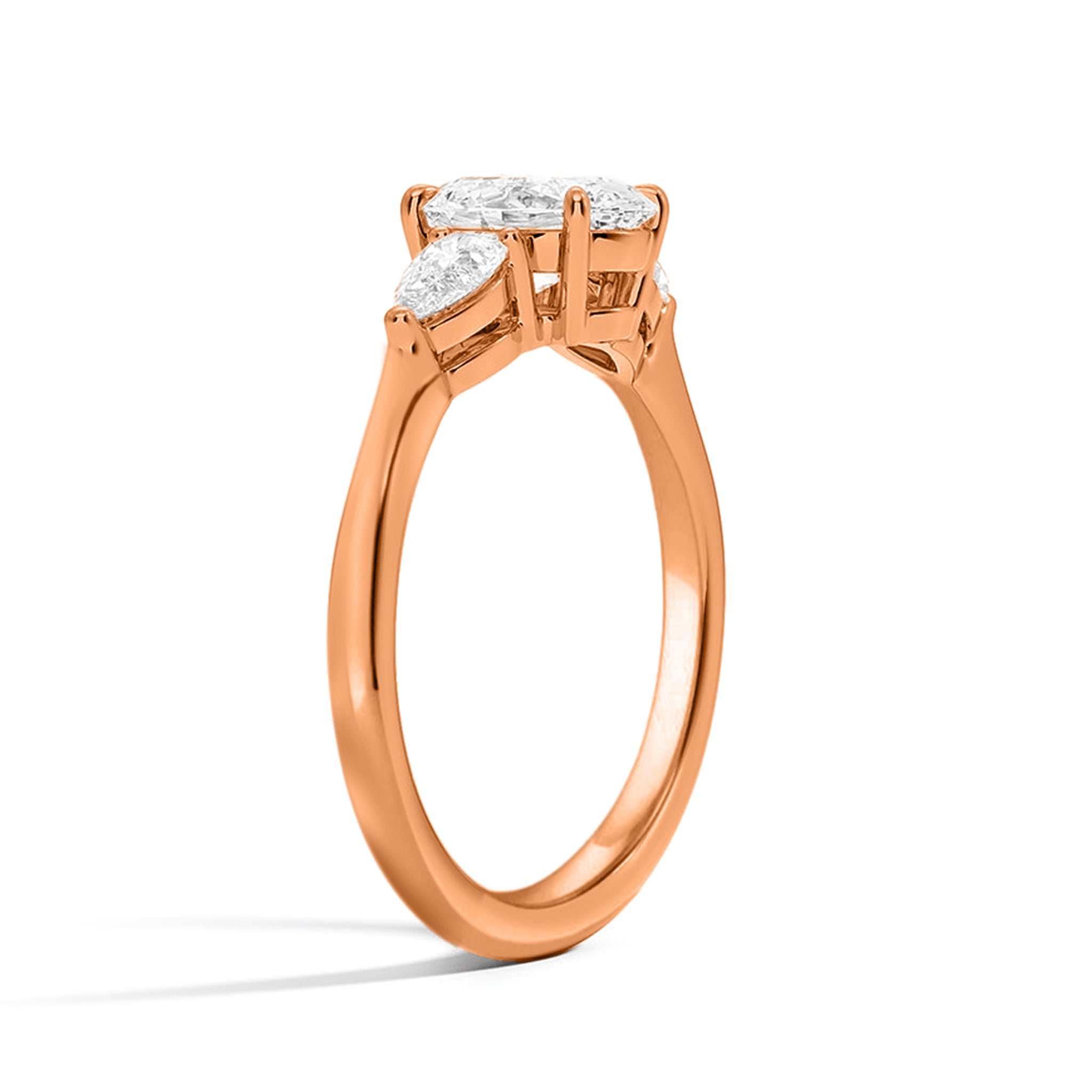 Emerald and Side Two Pear Three Diamond Ring