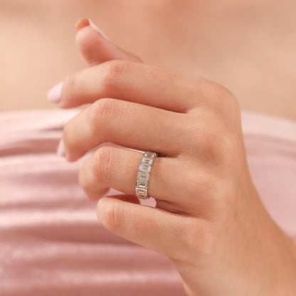 White gold Emerald Cut Wedding Band shown on hand, emphasizing its stackable and timeless design for women.