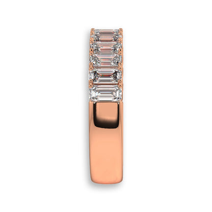 Side view of rose gold emerald cut diamond band. Features lab-grown diamonds in a half eternity style for elegant wear.