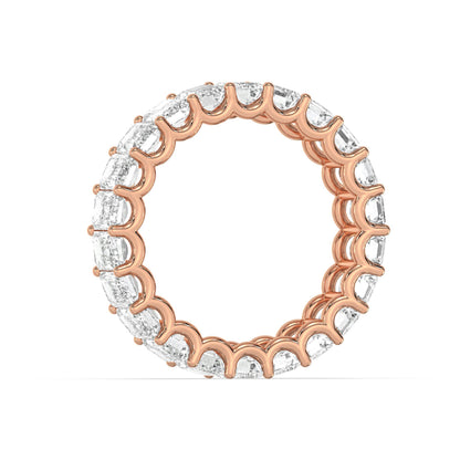 Side profile of rose gold Emerald Cut Eternity Wedding Ring with elegant moissanite diamond arrangement.