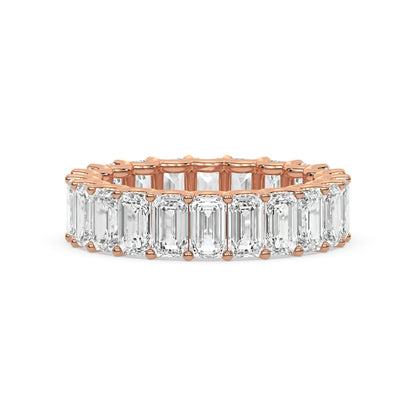 Emerald Cut Eternity Wedding Ring in rose gold featuring moissanite diamonds for a timeless wedding band look.