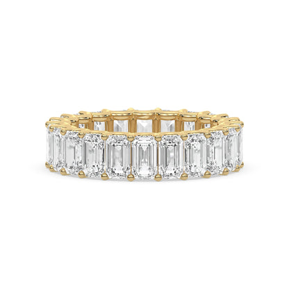 Emerald Cut Eternity Wedding Ring in yellow gold with moissanite stones, perfect for stacking or as a bridal band.