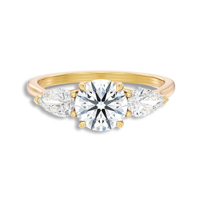 Round With Side Two Pear Shaped Three Stone Ring