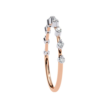 Side angle of rose gold Petite Round Lab Diamond Wedding Ring showcasing minimalist band and round diamonds.