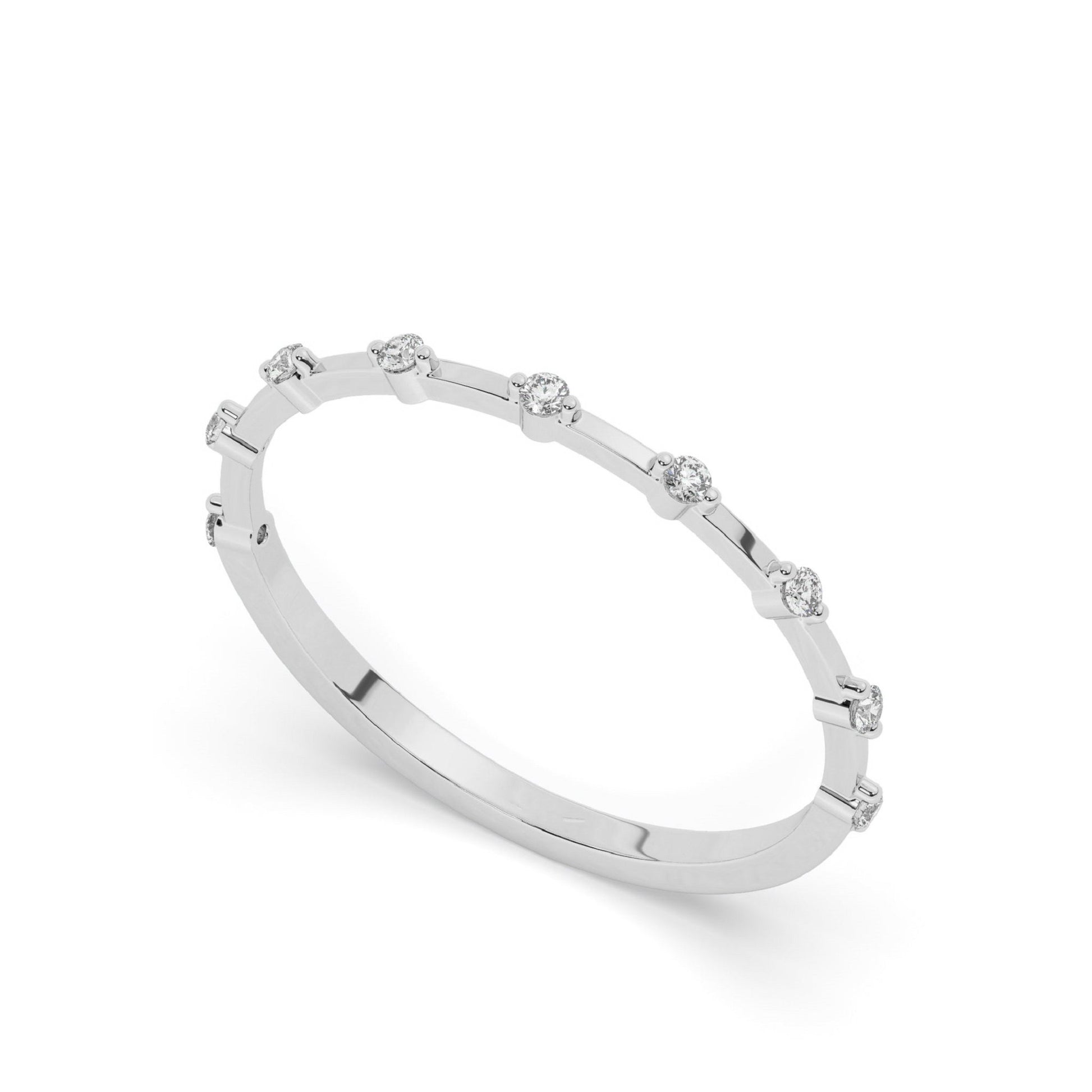 Minimalist white gold wedding band with spaced round pavé-set lab diamonds, ideal for a timeless and refined bridal or anniversary ring.