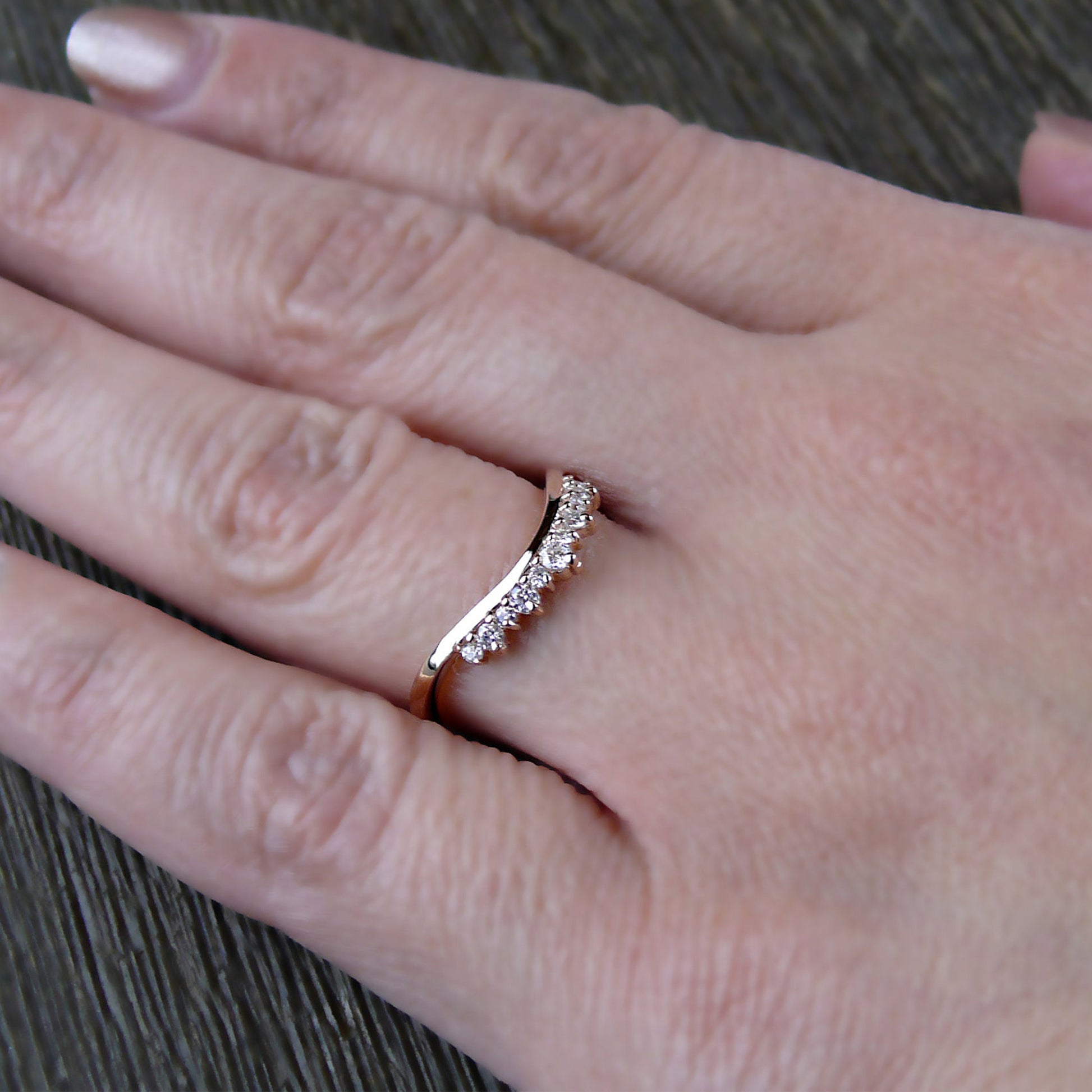 Rose gold Round Diamond Tiara Ring worn on hand, showcasing its elegant chevron shape and sparkling round diamonds.