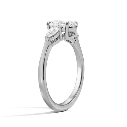 Emerald and Side Two Pear Three Diamond Ring