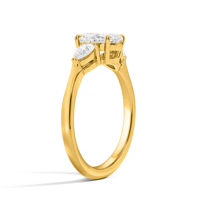 Emerald and Side Two Pear Three Diamond Ring